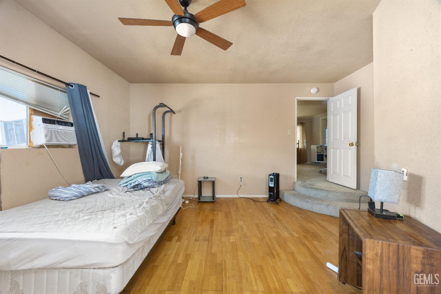 Undisclosed Address Edwards, CA 93523 - Photo 20 of 71 a bedroom with a bed and wooden floor