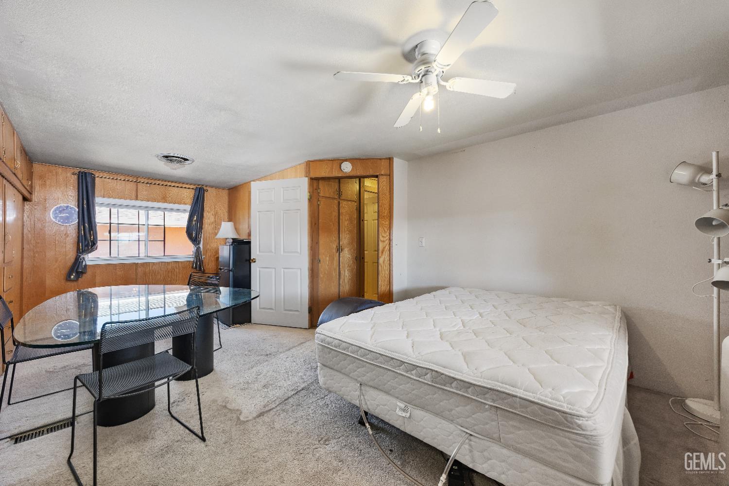 Undisclosed Address Edwards, CA 93523 - Photo 23 of 71 a bedroom with a bed a desk and chair with mirror