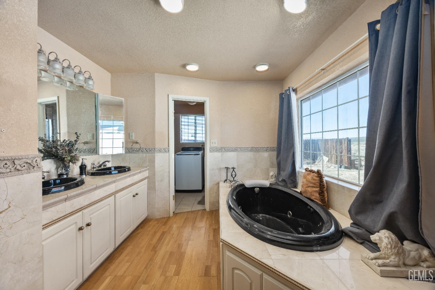 Undisclosed Address Edwards, CA 93523 - Photo 28 of 71 a kitchen with a sink stove and cabinets