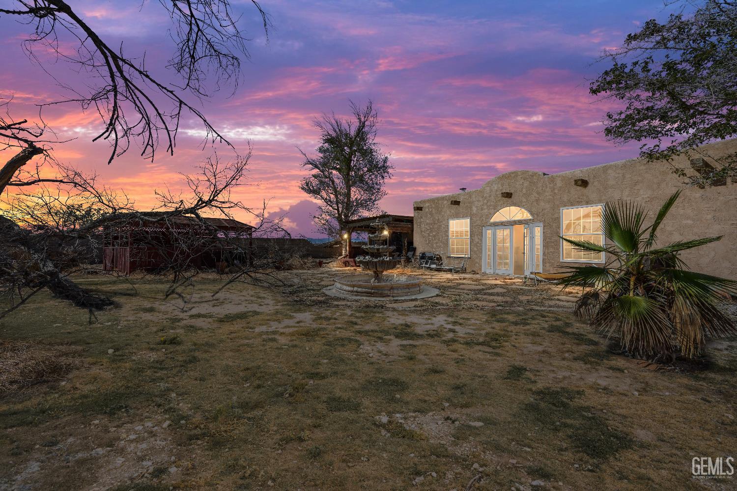 Undisclosed Address Edwards, CA 93523 - Photo 3 of 71 a backyard of a house with table and chairs