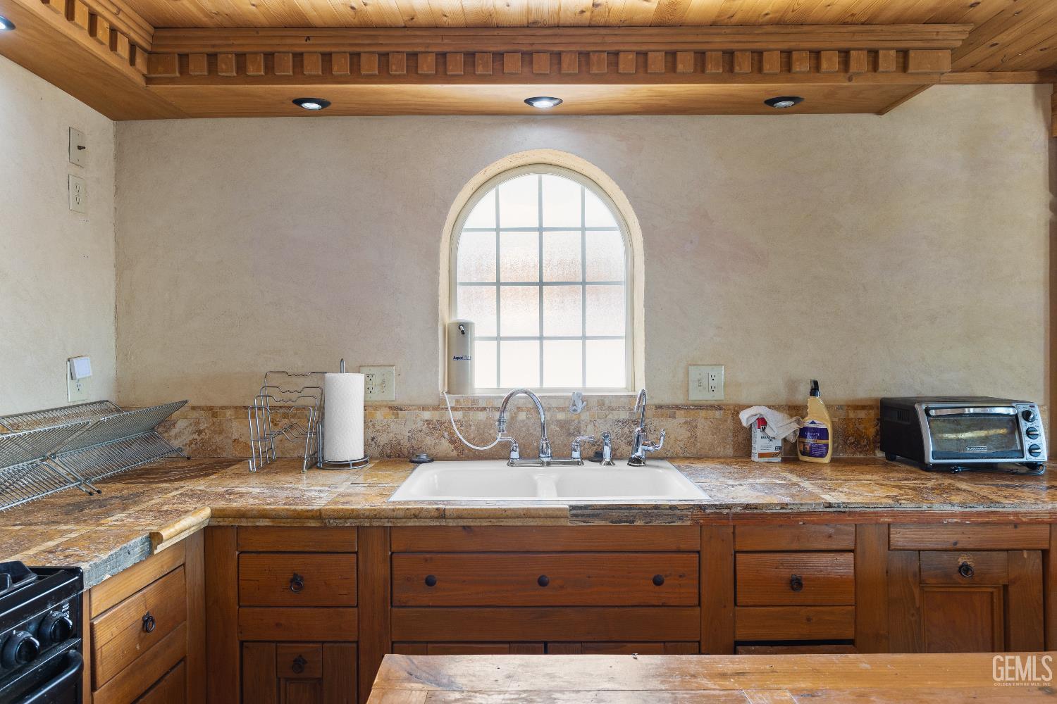 Undisclosed Address Edwards, CA 93523 - Photo 31 of 71 a bathroom with a granite countertop sink a mirror and a window
