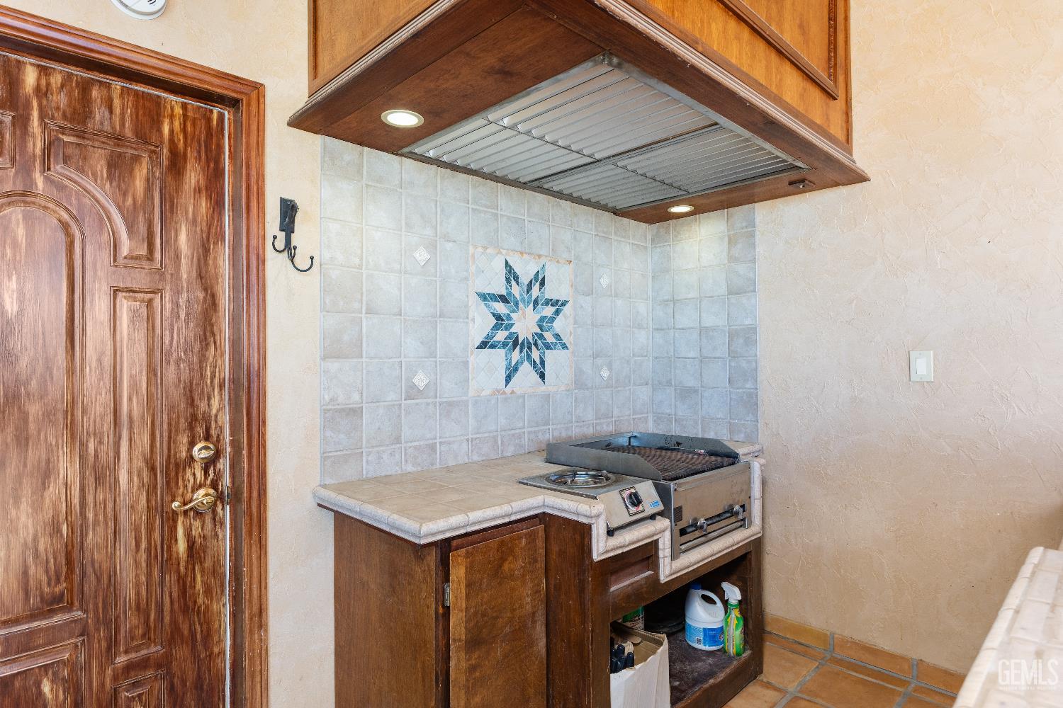 Undisclosed Address Edwards, CA 93523 - Photo 37 of 71 a stove top oven sitting inside of a kitchen
