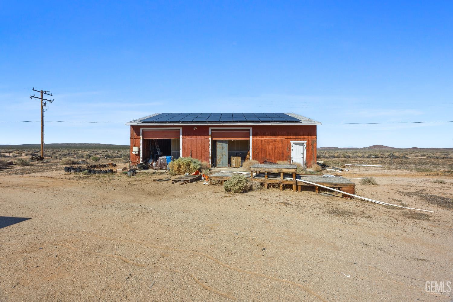 Undisclosed Address Edwards, CA 93523 - Photo 46 of 71 a view of a house with swimming pool and sitting area