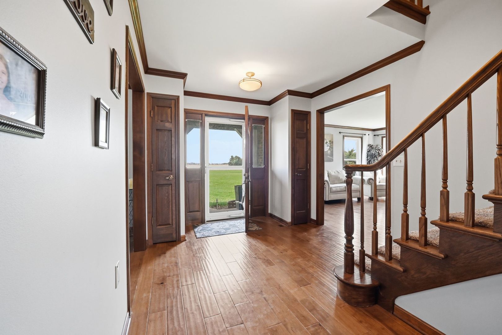 8N316 McGough Road Maple Park, IL 60151 - Photo 4 of 46 a view of an entryway with wooden floor and door