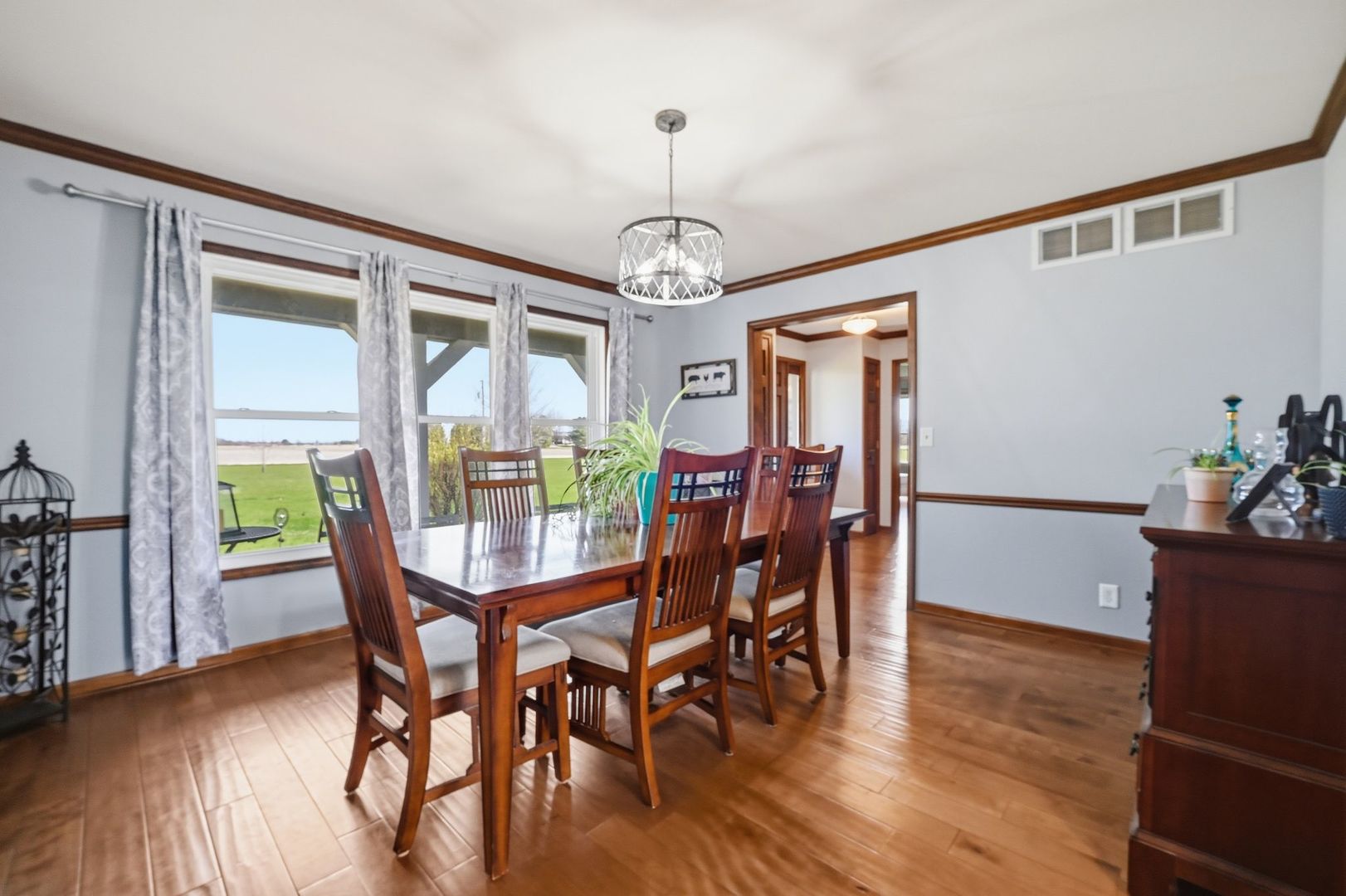 8N316 McGough Road Maple Park, IL 60151 - Photo 6 of 46 a view of a dining room with furniture window and wooden floor