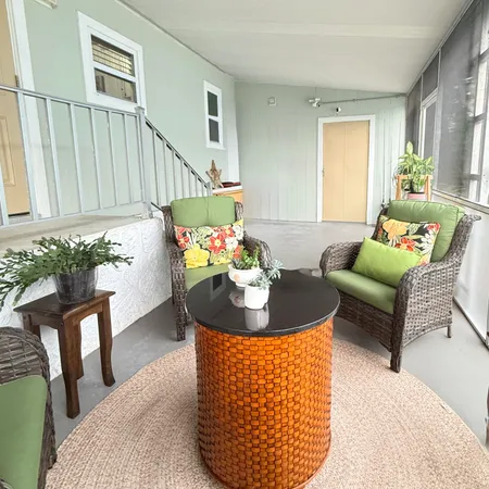 a bathroom with a shower curtain and a window