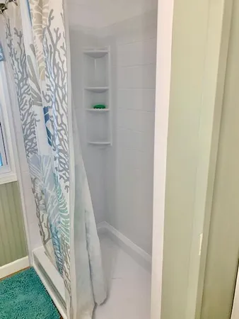 a view of a swimming pool with a table and chairs