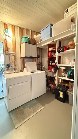 a view of a tennis court with sitting area