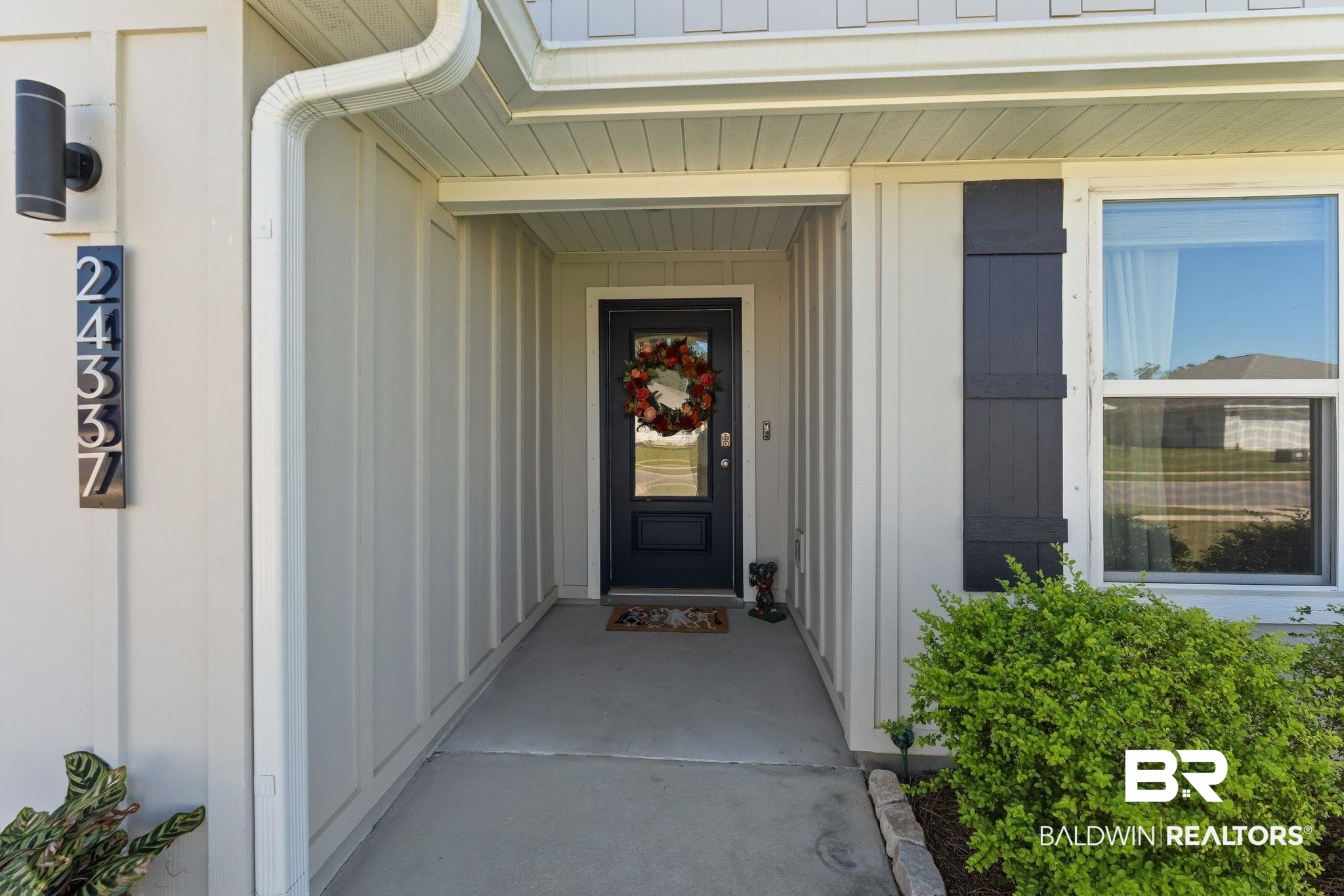 24337 Ringneck Loop Elberta, AL 36530 - Photo 3 of 34 View of exterior entry featuring board and batten siding