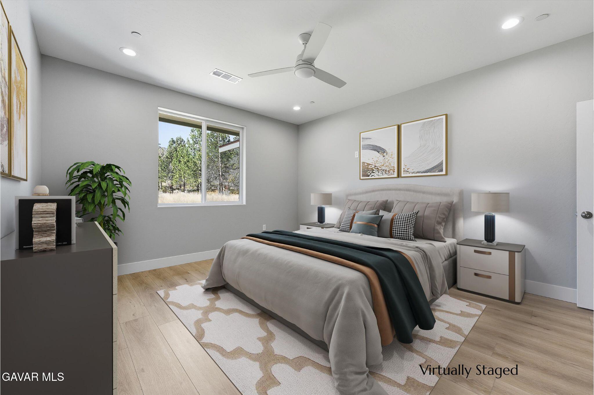 22613 Royal Place Tehachapi, CA 93561 - Photo 16 of 26 a bedroom with bed and a window