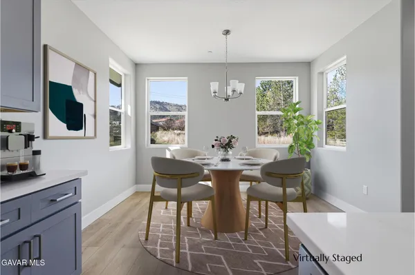 a large kitchen with stainless steel appliances granite countertop a large stove a sink dishwasher and a refrigerator with wooden floor