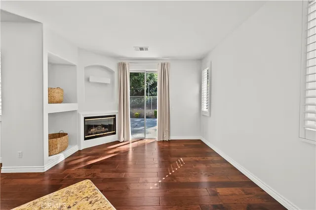 a view of livingroom with furniture and a fireplace