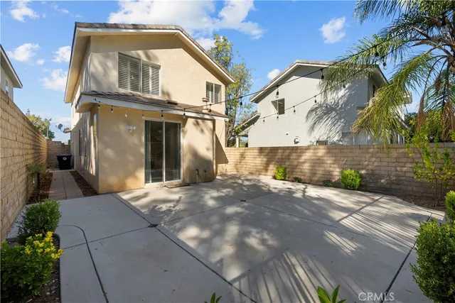 a view of a white house with a yard