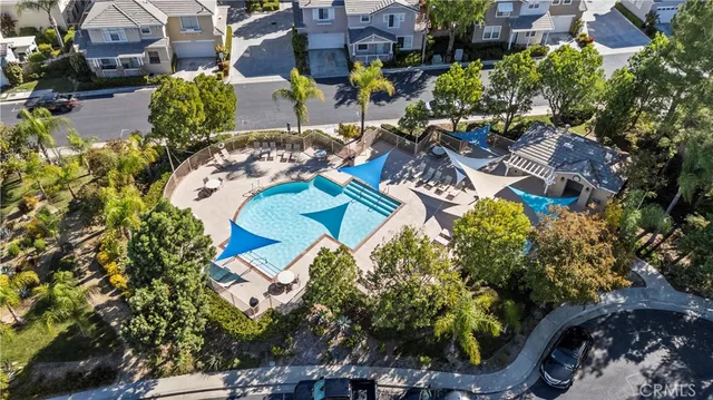 an aerial view of residential house with outdoor space and swimming pool