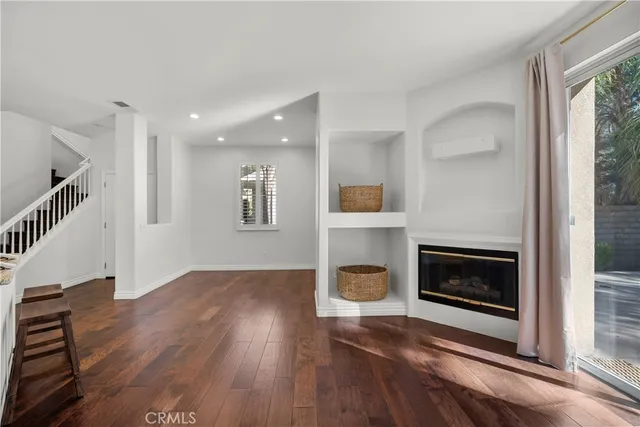 a view of an empty room and fire place