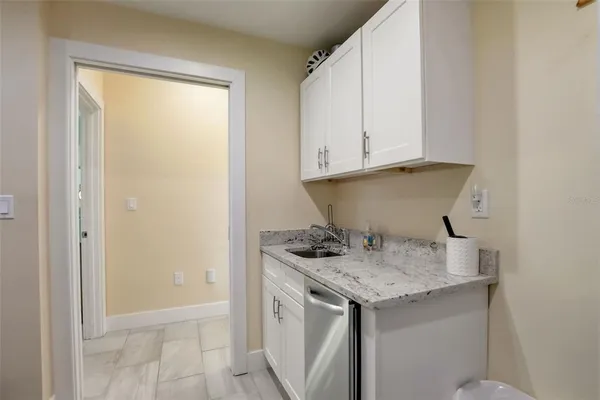 a view of a lake with a table and chairs