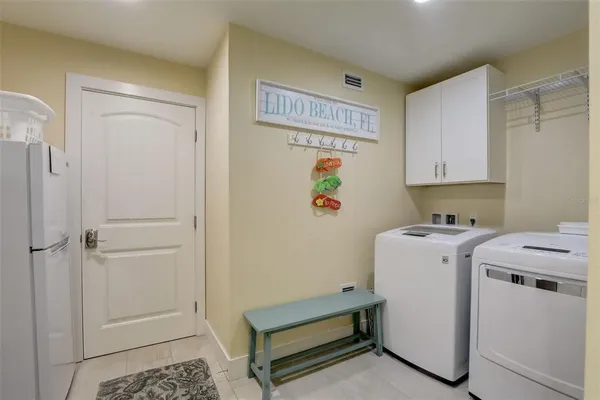 a view of a house with pool and sitting area