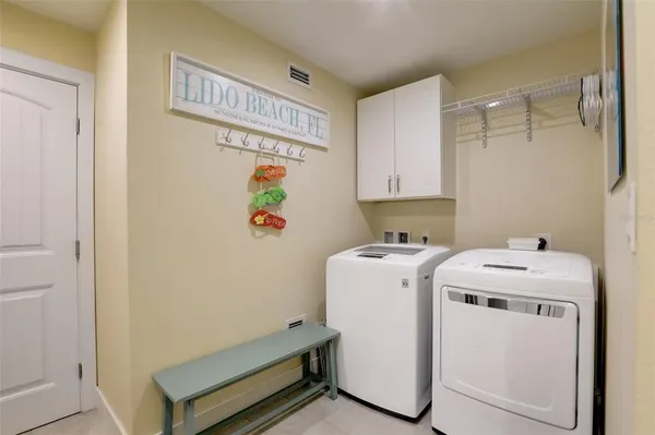 a view of house with swimming pool and lake view