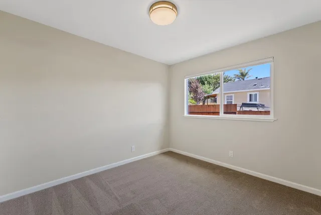 a view of an empty room and entryway
