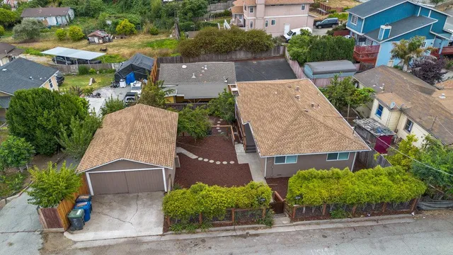 an aerial view of house with yard