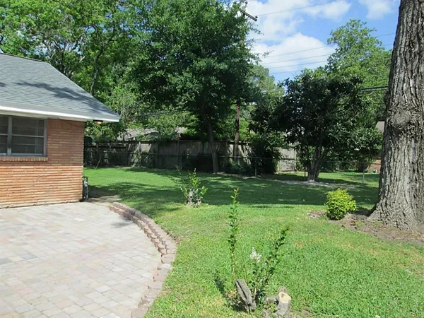 a view of a patio with a yard