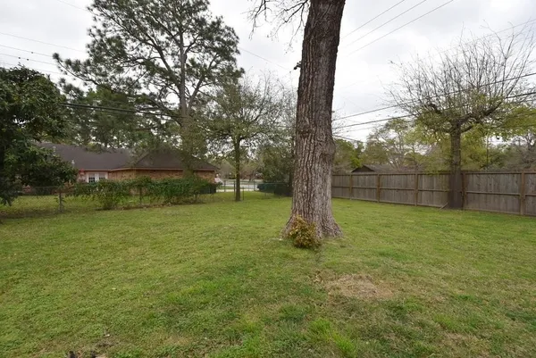 a view of outdoor space with deck and yard