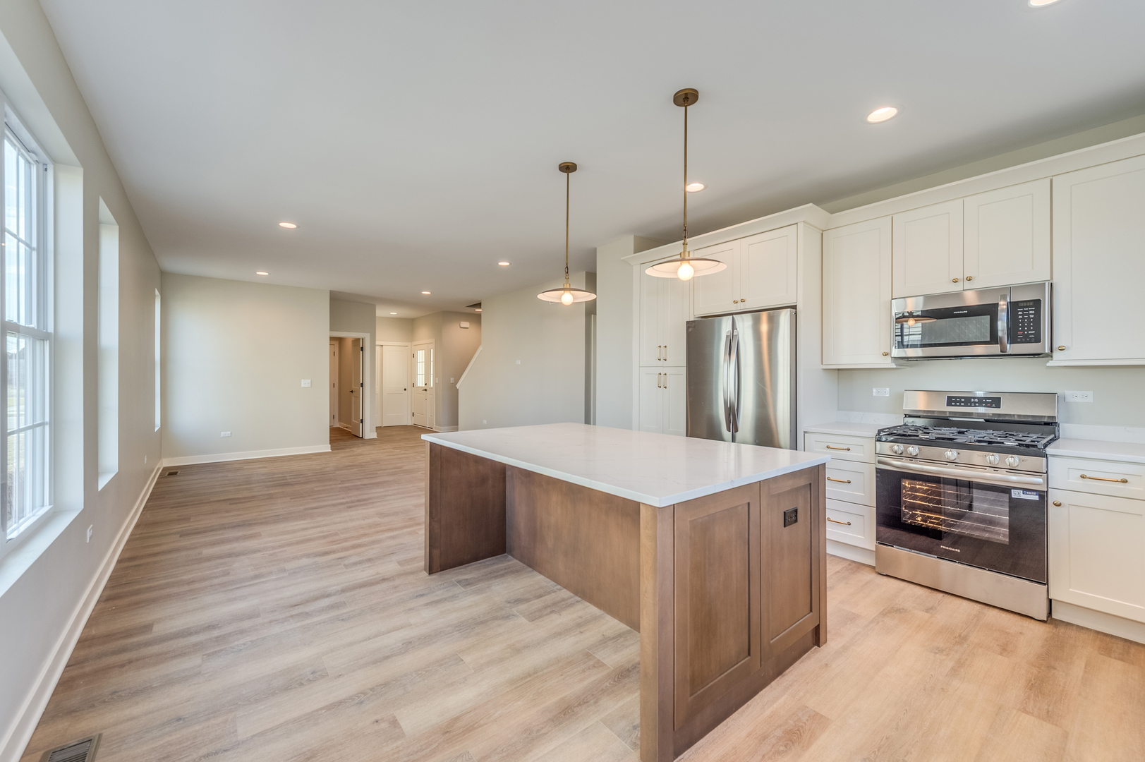 1076 Freedom Road Elburn, IL 60119 - Photo 12 of 31 a kitchen with kitchen island a sink stainless steel appliances and cabinets