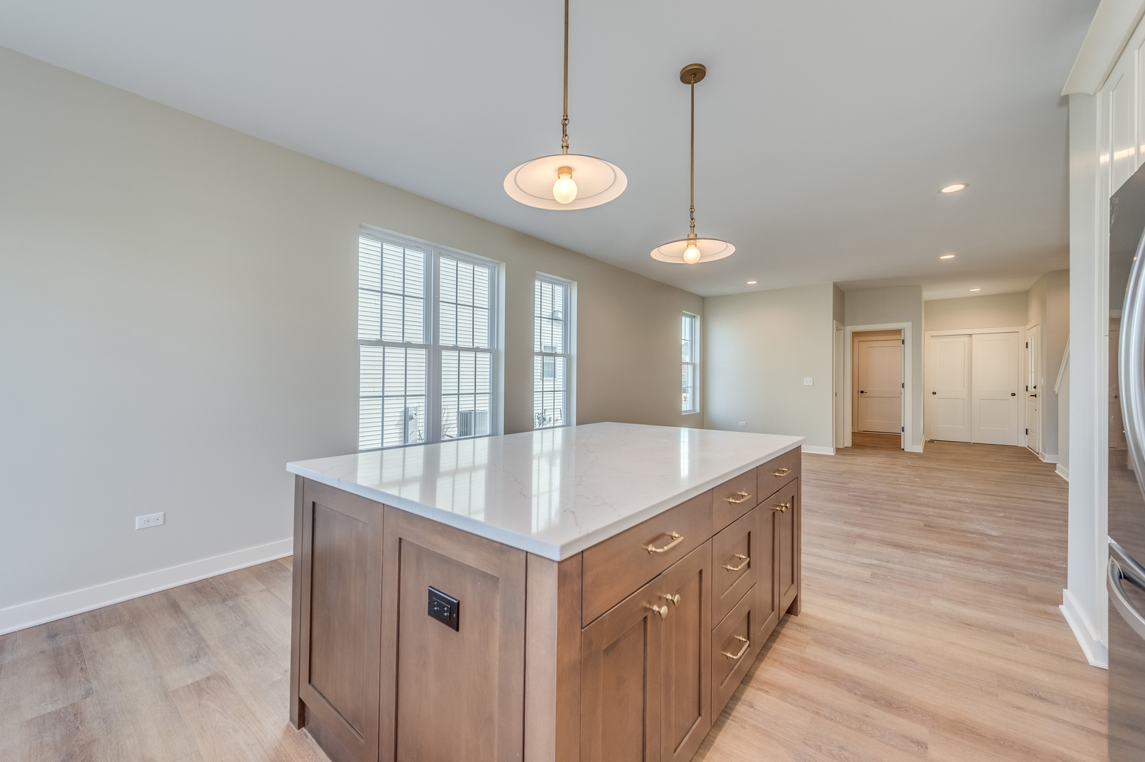 1076 Freedom Road Elburn, IL 60119 - Photo 14 of 31 a kitchen with a sink and chandelier