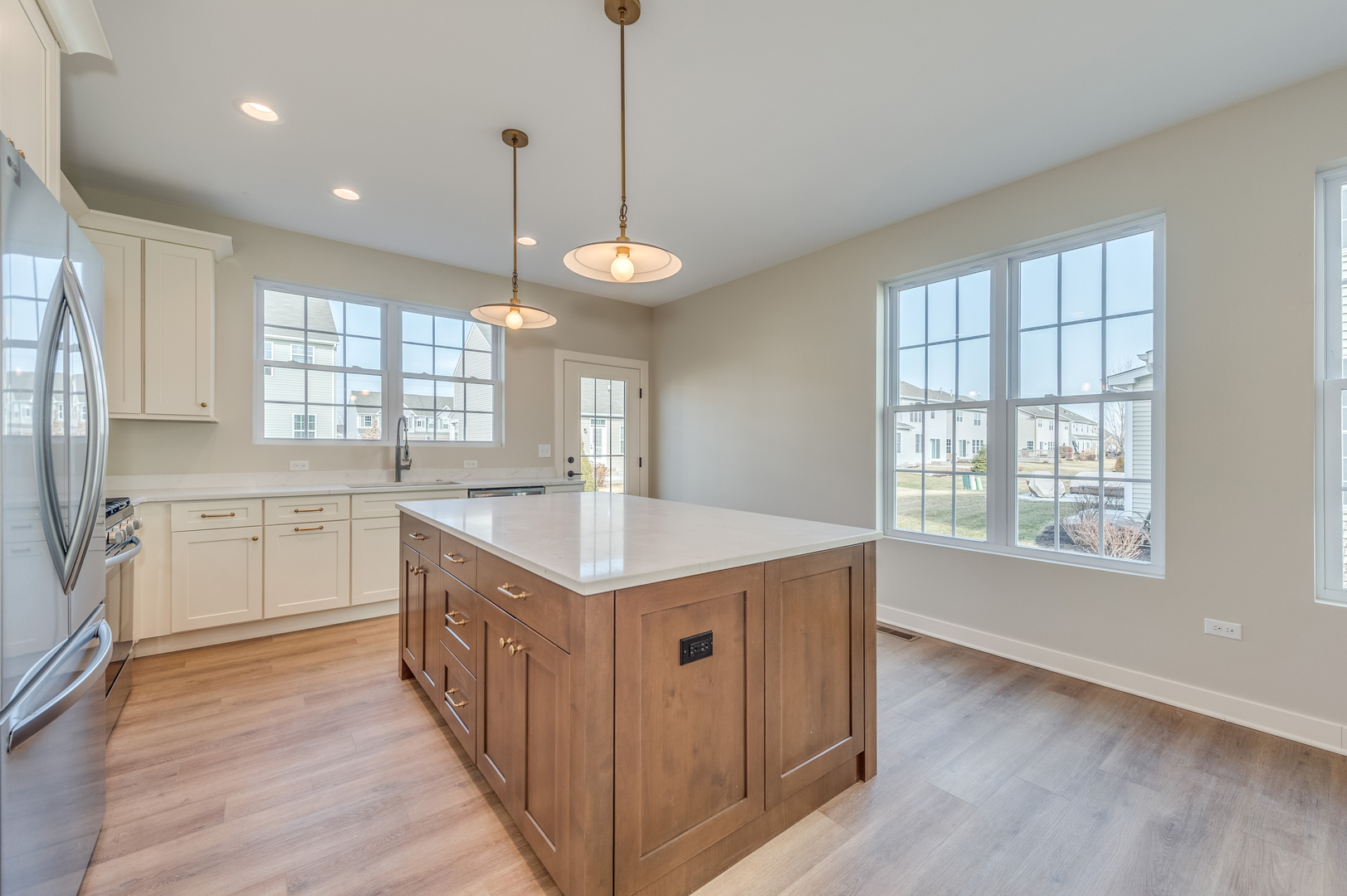 1076 Freedom Road Elburn, IL 60119 - Photo 15 of 31 a kitchen with center island and windows
