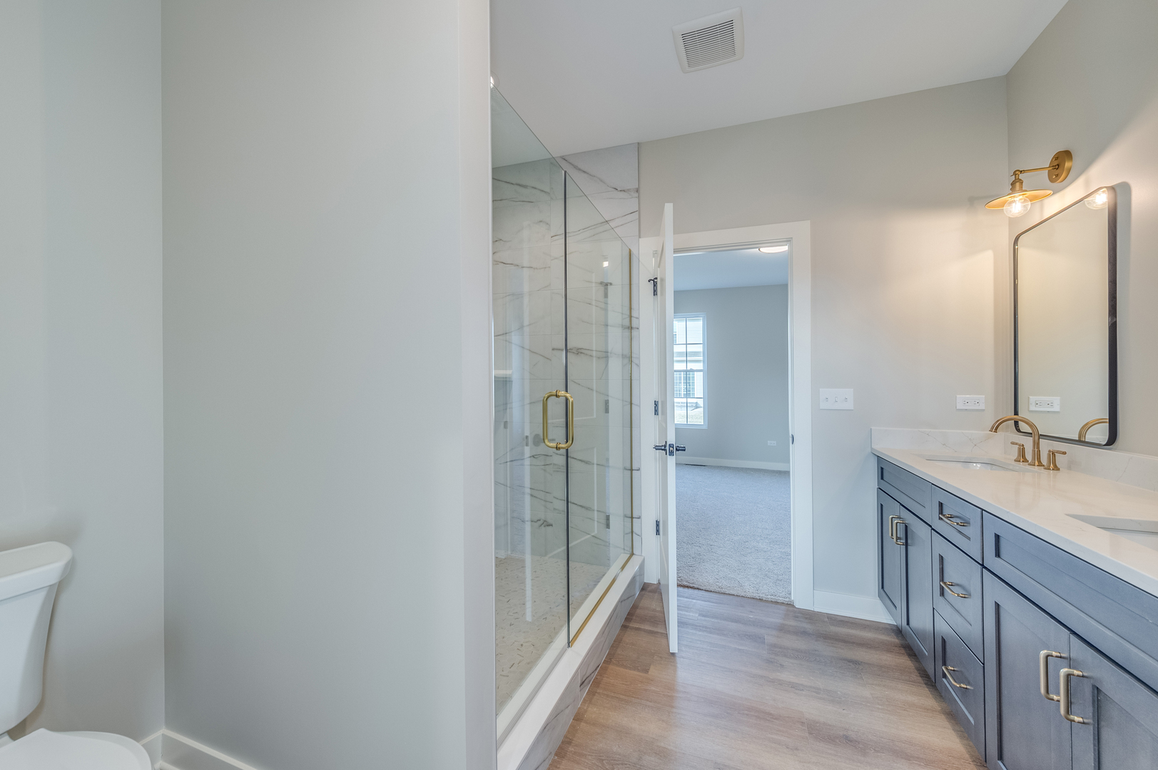 1076 Freedom Road Elburn, IL 60119 - Photo 20 of 31 a bathroom with a granite countertop sink mirror and toilet