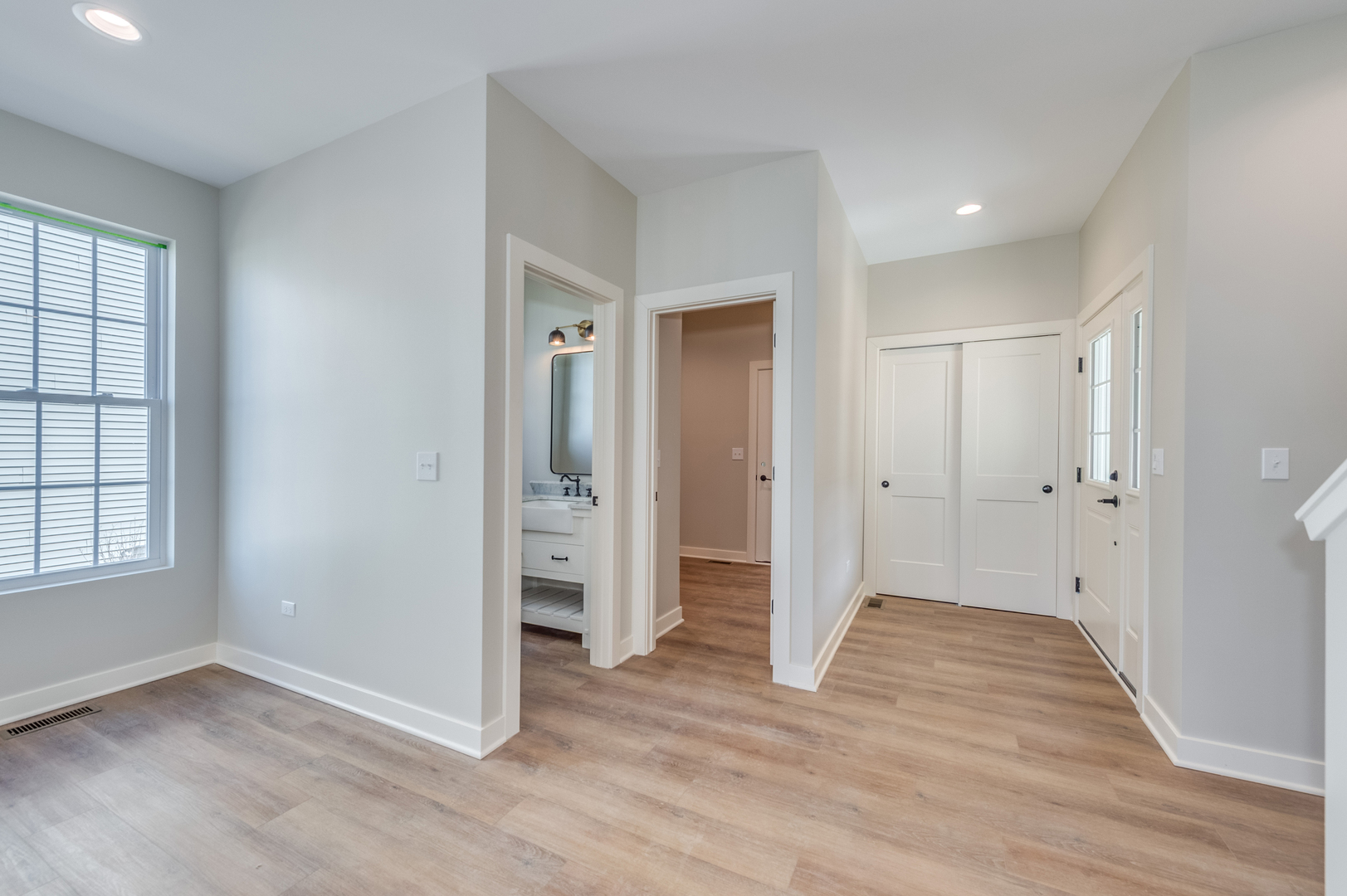 1076 Freedom Road Elburn, IL 60119 - Photo 4 of 31 an empty room with wooden floor & windows and closet