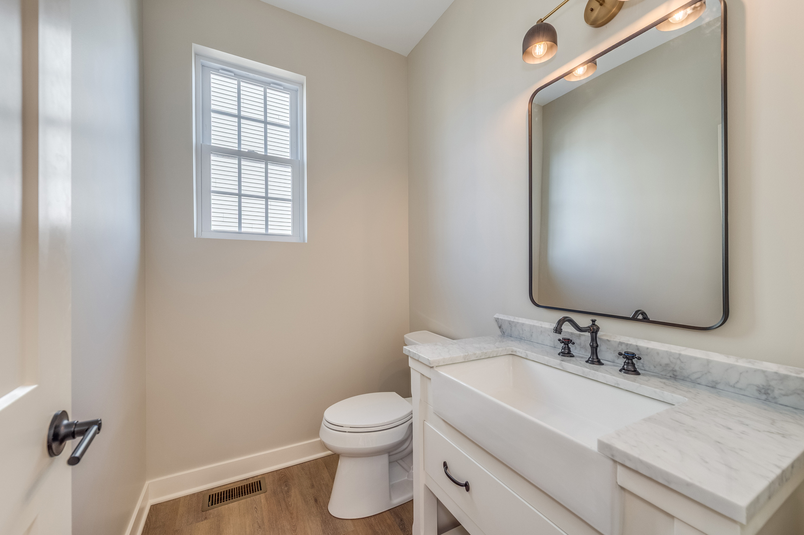 1076 Freedom Road Elburn, IL 60119 - Photo 5 of 31 a bathroom with a sink vanity and a toilet