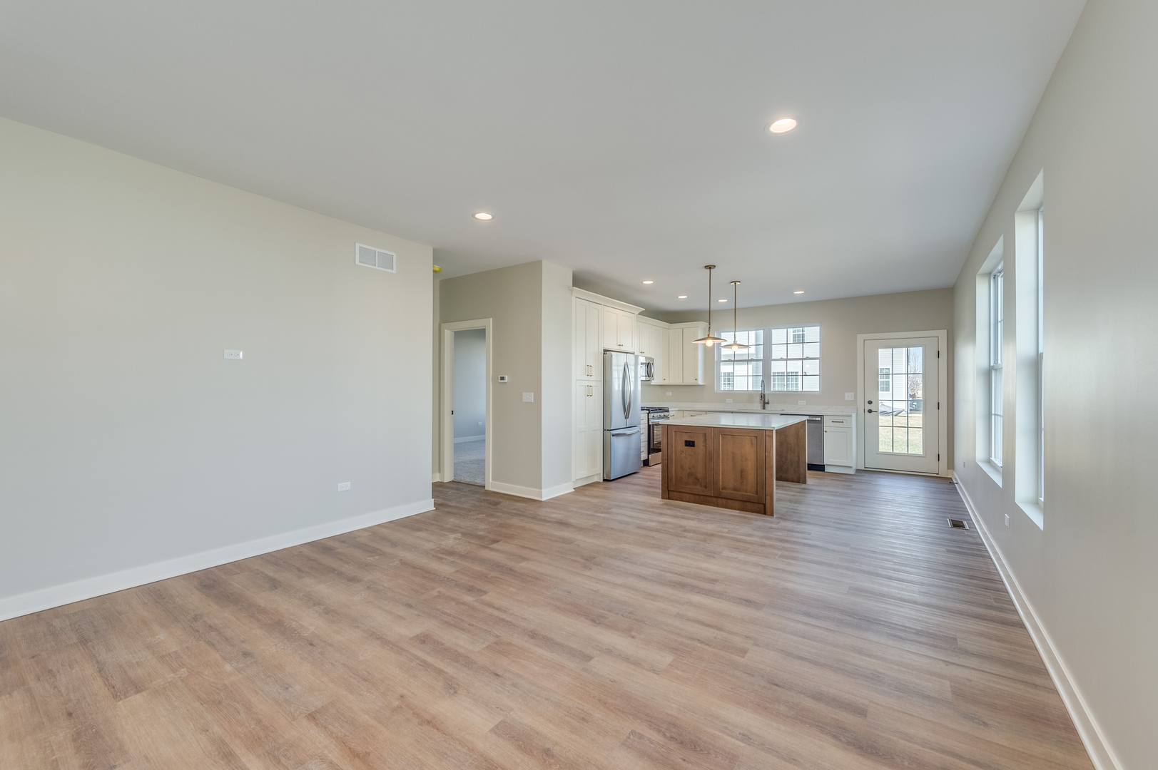 1076 Freedom Road Elburn, IL 60119 - Photo 9 of 31 a view of an empty room with wooden floor and a window