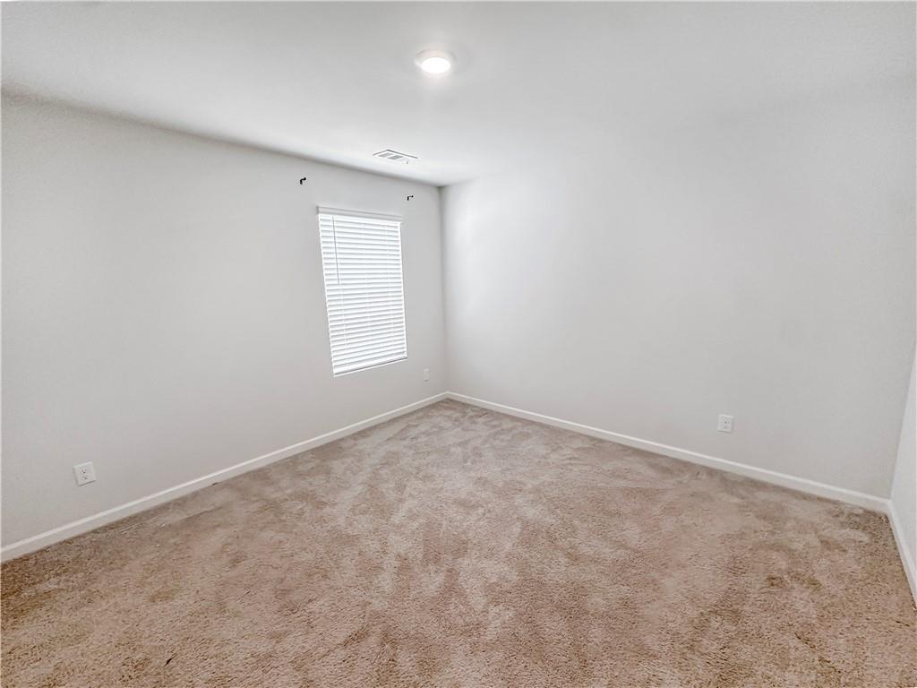 965 Athena Bend Fairburn, GA 30213 - Photo 10 of 37 an empty room with a window