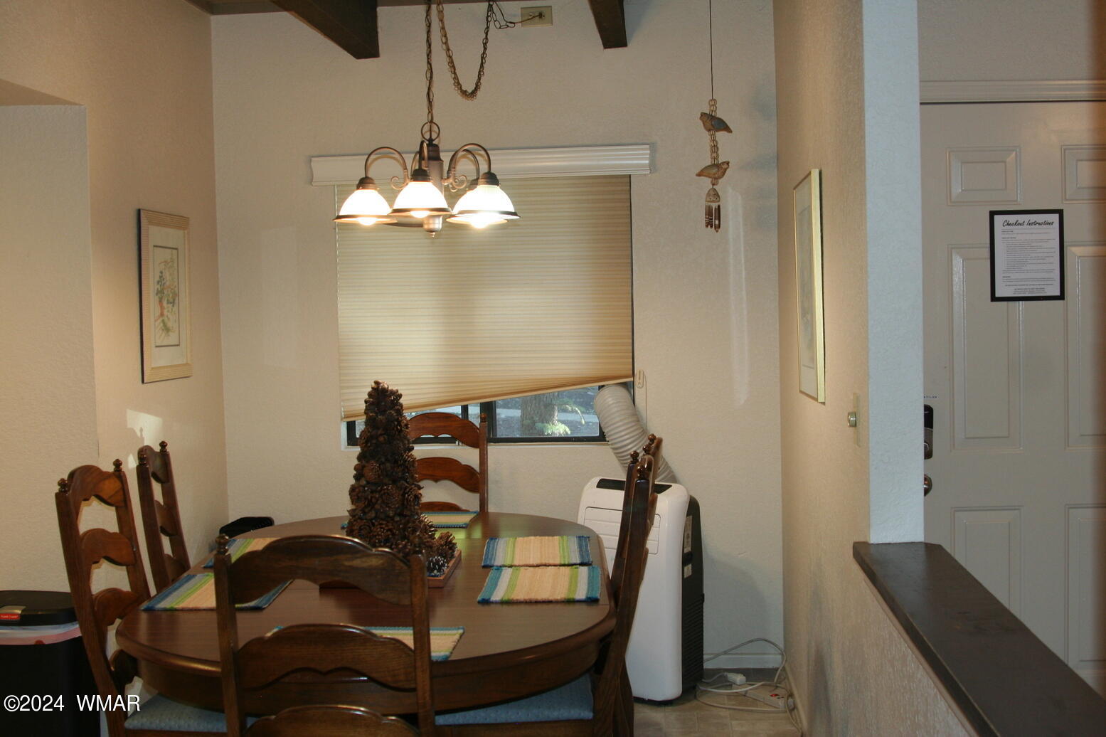 2820 Sports Village Loop Pinetop, AZ 85935 - Photo 11 of 24 a view of a dining room with furniture and chandelier