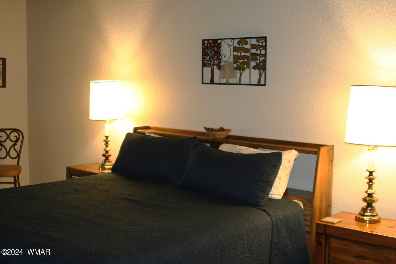 2820 Sports Village Loop Pinetop, AZ 85935 - Photo 12 of 24 a bed sitting in a bedroom next to a window