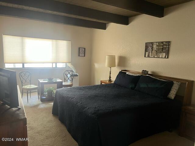 2820 Sports Village Loop Pinetop, AZ 85935 - Photo 14 of 24 a bed sitting in a bedroom next to a window