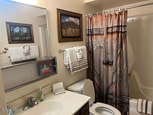 2820 Sports Village Loop Pinetop, AZ 85935 - Photo 20 of 24 a bathroom with a sink a toilet and shower