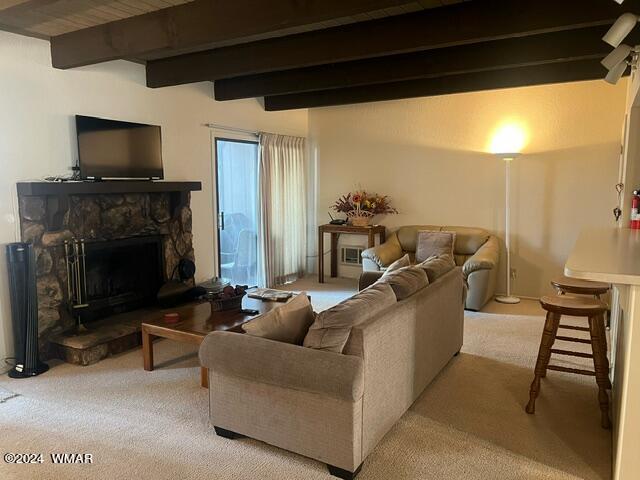 2820 Sports Village Loop Pinetop, AZ 85935 - Photo 2 of 24 a living room with furniture a fireplace and a flat screen tv