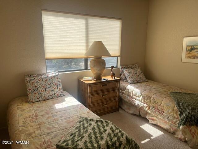 2820 Sports Village Loop Pinetop, AZ 85935 - Photo 21 of 24 a bedroom with a bed and window