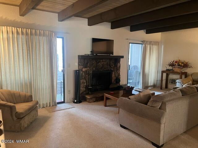 2820 Sports Village Loop Pinetop, AZ 85935 - Photo 3 of 24 a living room with furniture a fireplace and a flat screen tv