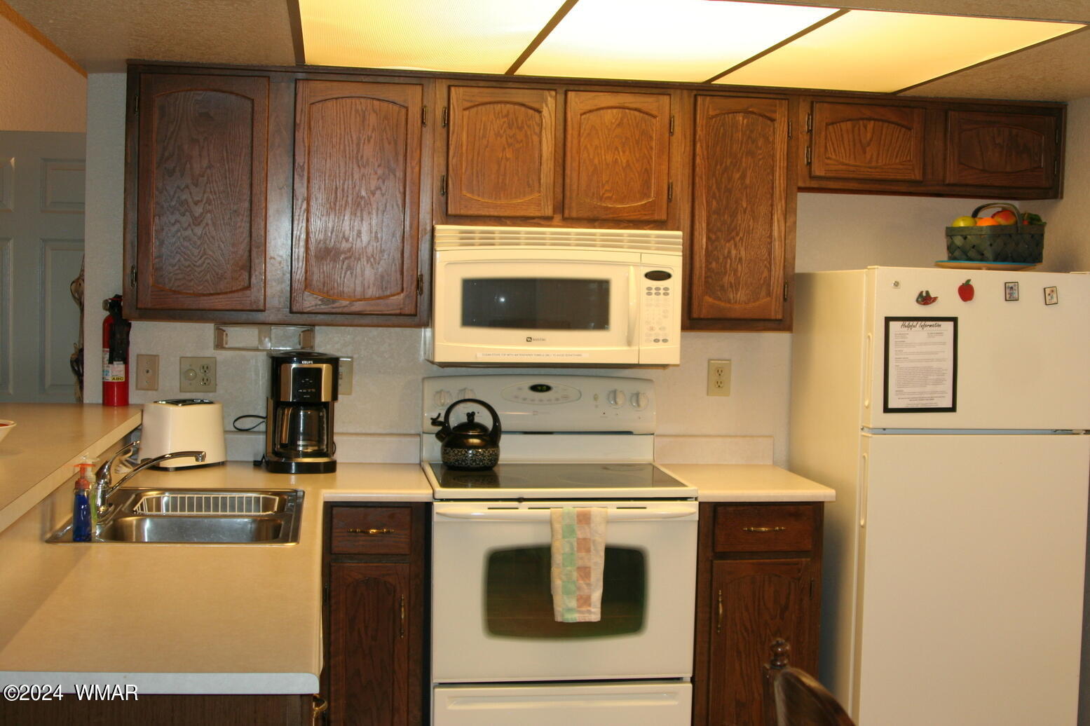 2820 Sports Village Loop Pinetop, AZ 85935 - Photo 7 of 24 a kitchen with stainless steel appliances a stove a microwave and a refrigerator