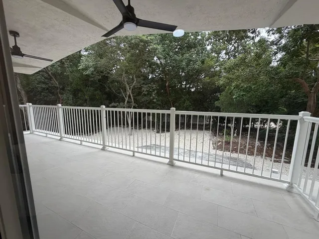 a view of balcony and yard
