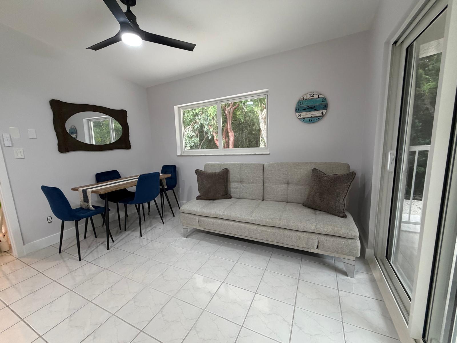 219 South Bay Harbor Drive, Unit B Key Largo, FL 33037 - Photo 6 of 16 a living room with furniture and a window