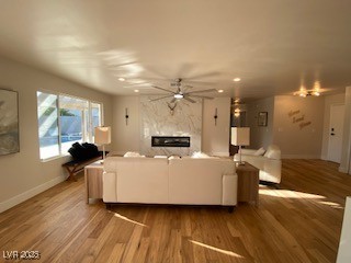 2712 Rialto Road Las Vegas, NV 89108 - Photo 28 of 54 Living room featuring ceiling fan, a high end fireplace, wood finished floors, and recessed lighting
