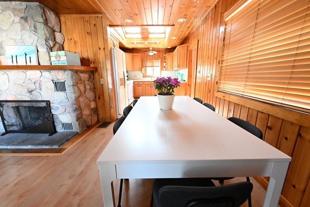 7 Glendale Road Wareham, MA 02558 - Photo 11 of 27 a view of a dining room with furniture and a fireplace