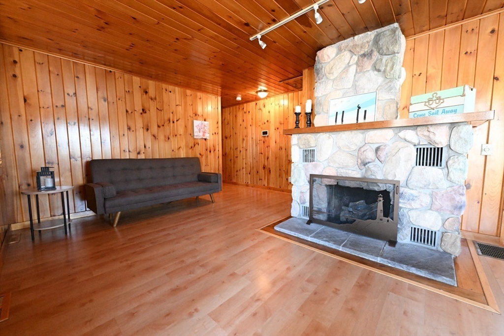 7 Glendale Road Wareham, MA 02558 - Photo 12 of 27 a living room with furniture and a fireplace