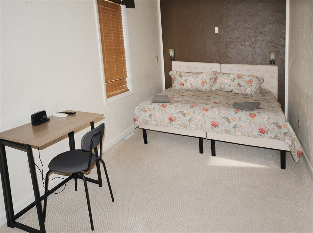 7 Glendale Road Wareham, MA 02558 - Photo 16 of 27 a bedroom with a bed and a desk
