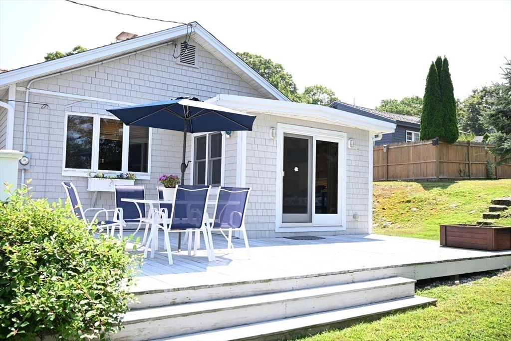 7 Glendale Road Wareham, MA 02558 - Photo 22 of 27 a view of a house with a yard and furniture