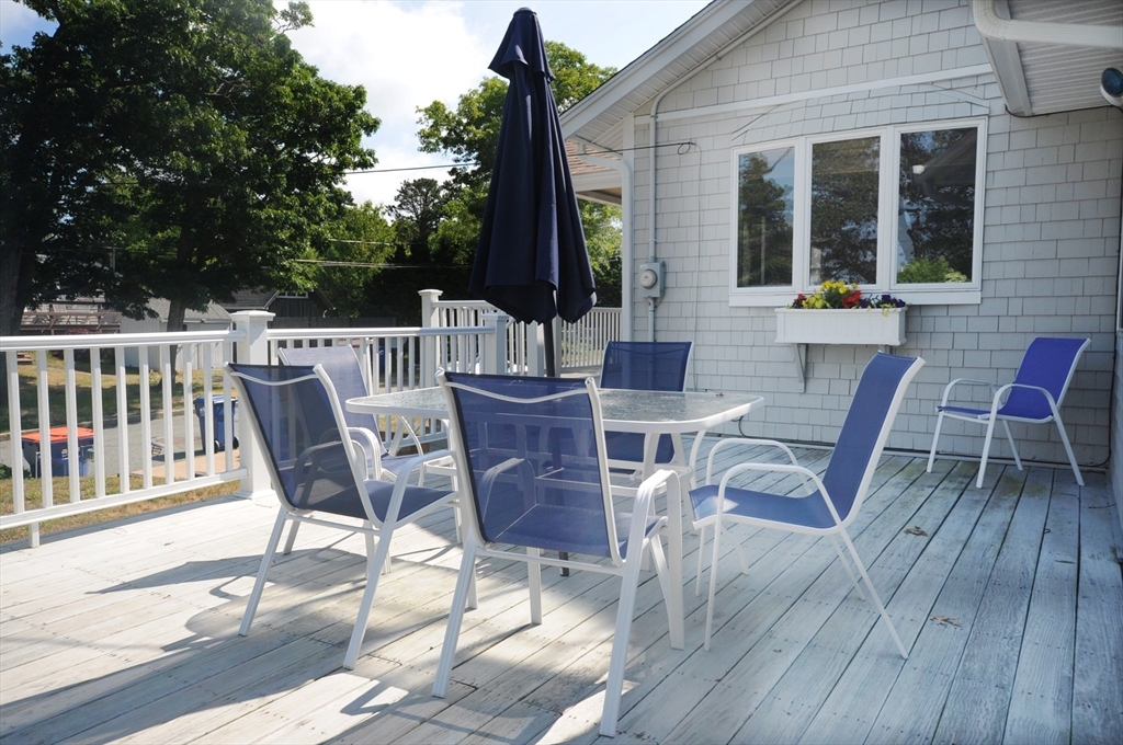 7 Glendale Road Wareham, MA 02558 - Photo 5 of 27 a view of a deck with table and chairs and wooden floor